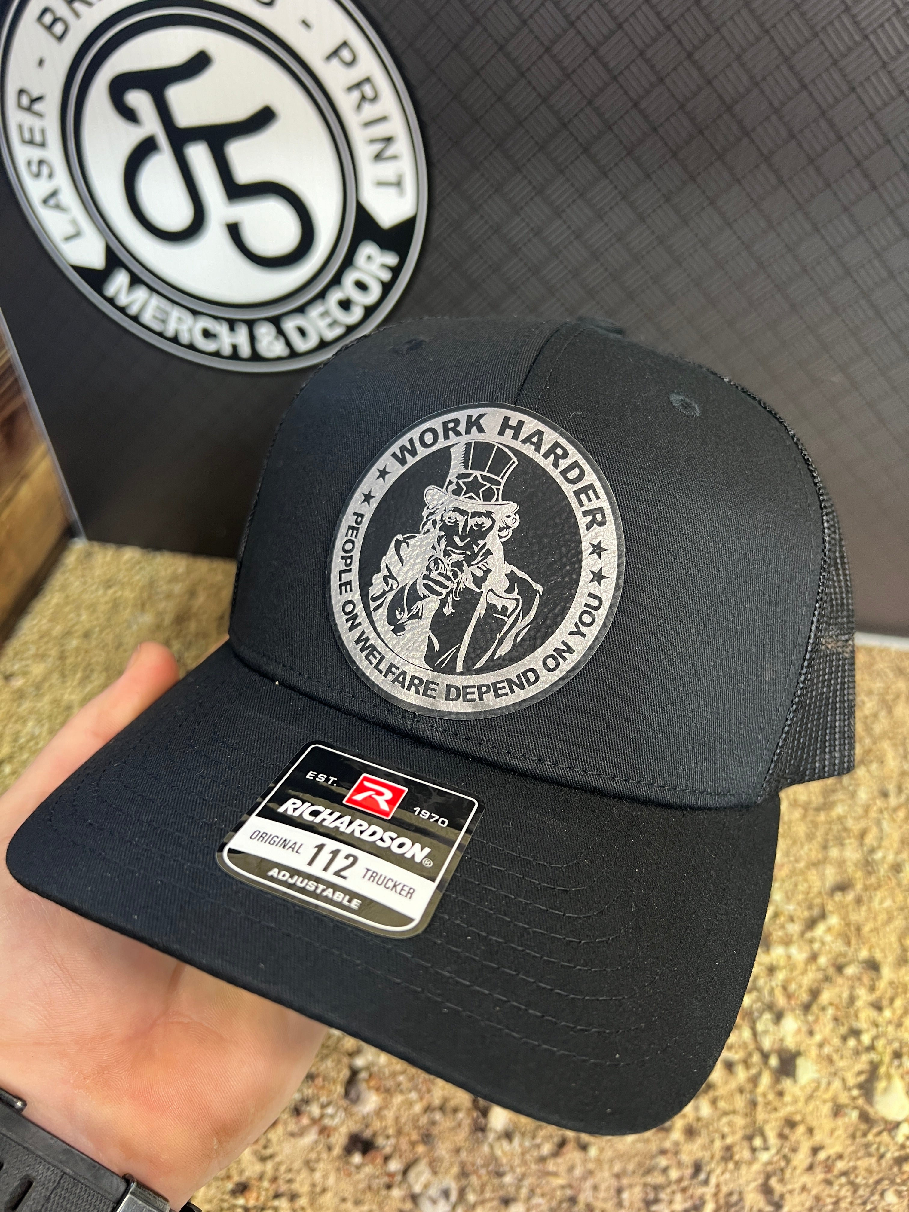 Work Harder Hat Design with a Premium Leatherette Patch on a Richardson 112 Trucker Hat for Conservative Americans.