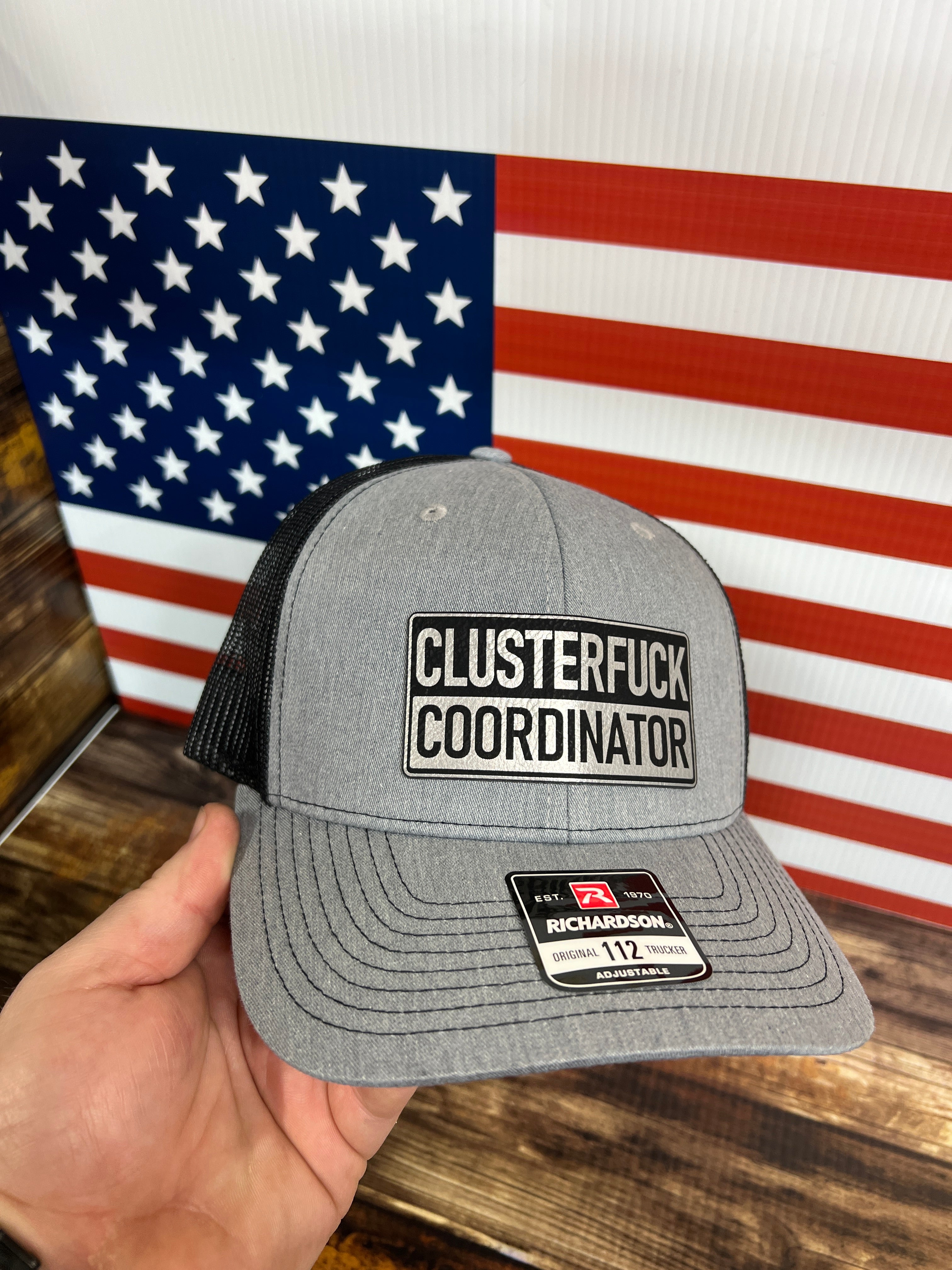 Clusterfu*k Coordinator Trucker Hat with Premium Leatherette Patch on a Richardson 112 Hat