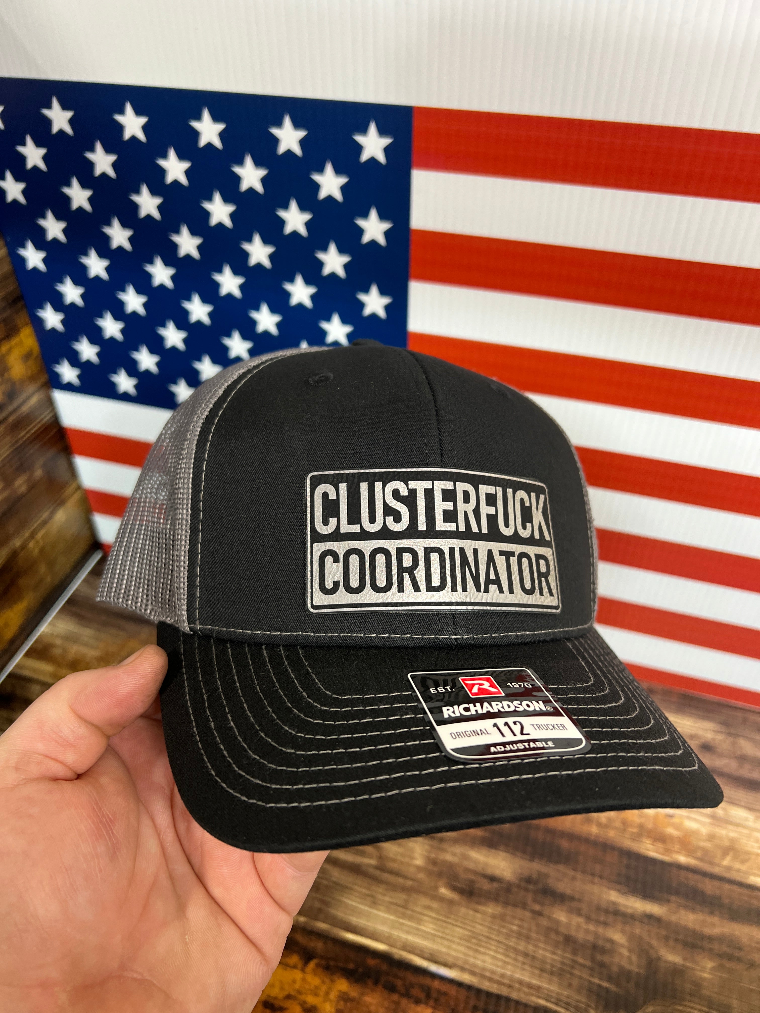 Clusterfu*k Coordinator Trucker Hat with Premium Leatherette Patch on a Richardson 112 Hat