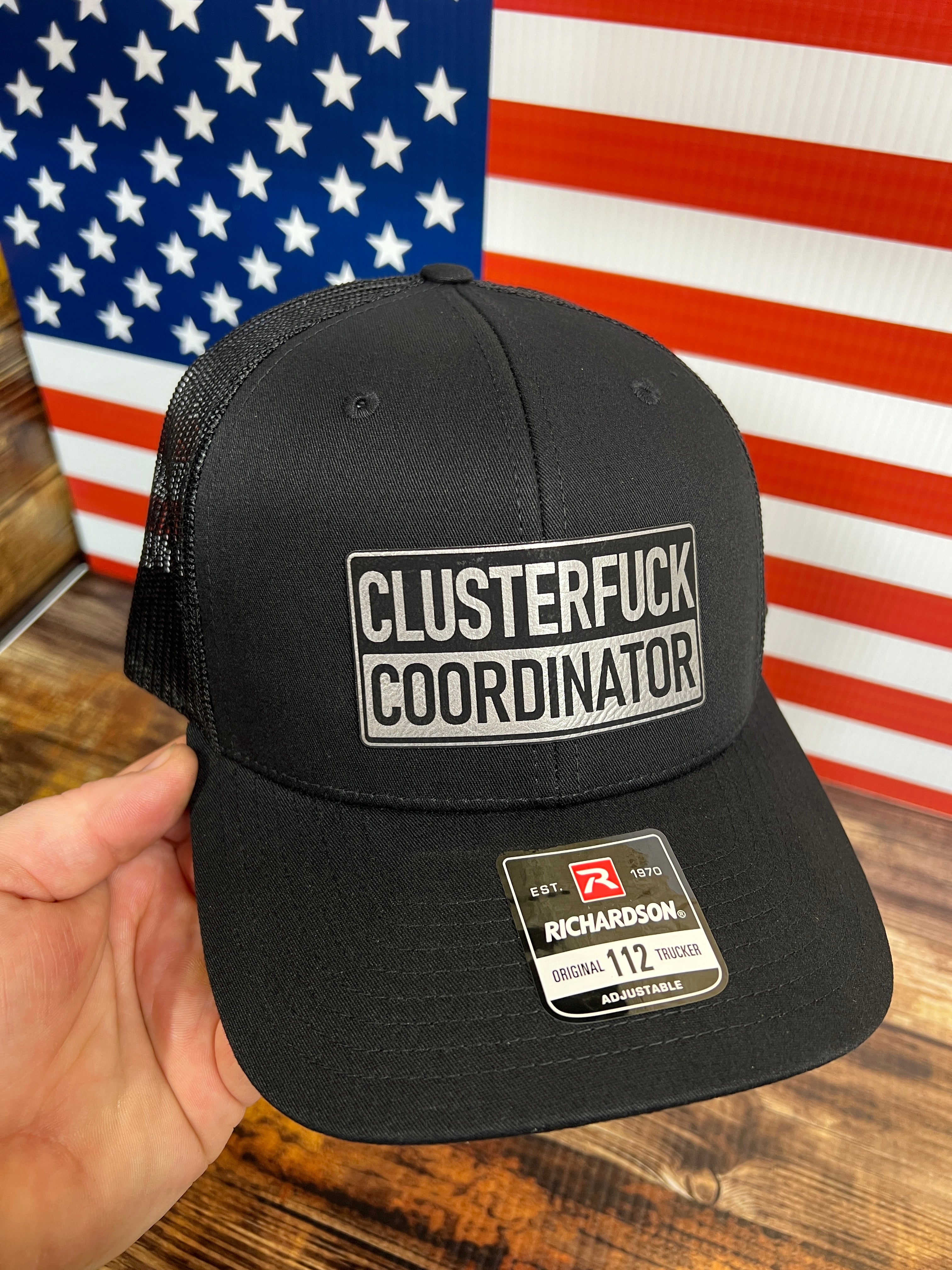 Clusterfu*k Coordinator Trucker Hat with Premium Leatherette Patch on a Richardson 112 Hat