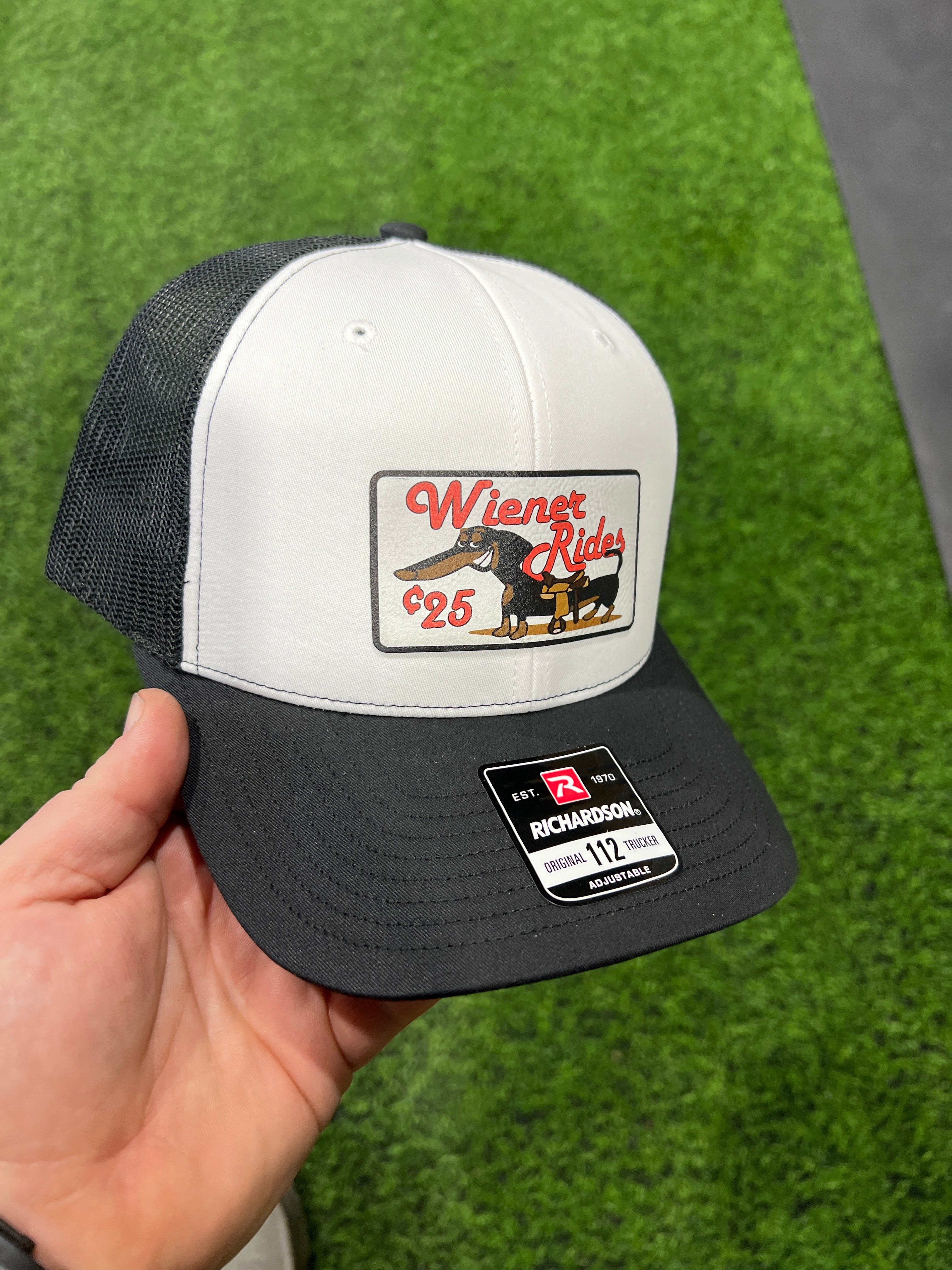 Wiener Rides Patch Hat with a UV Printed Premium Leatherette Patch on a Richardson 112 Trucker Hat