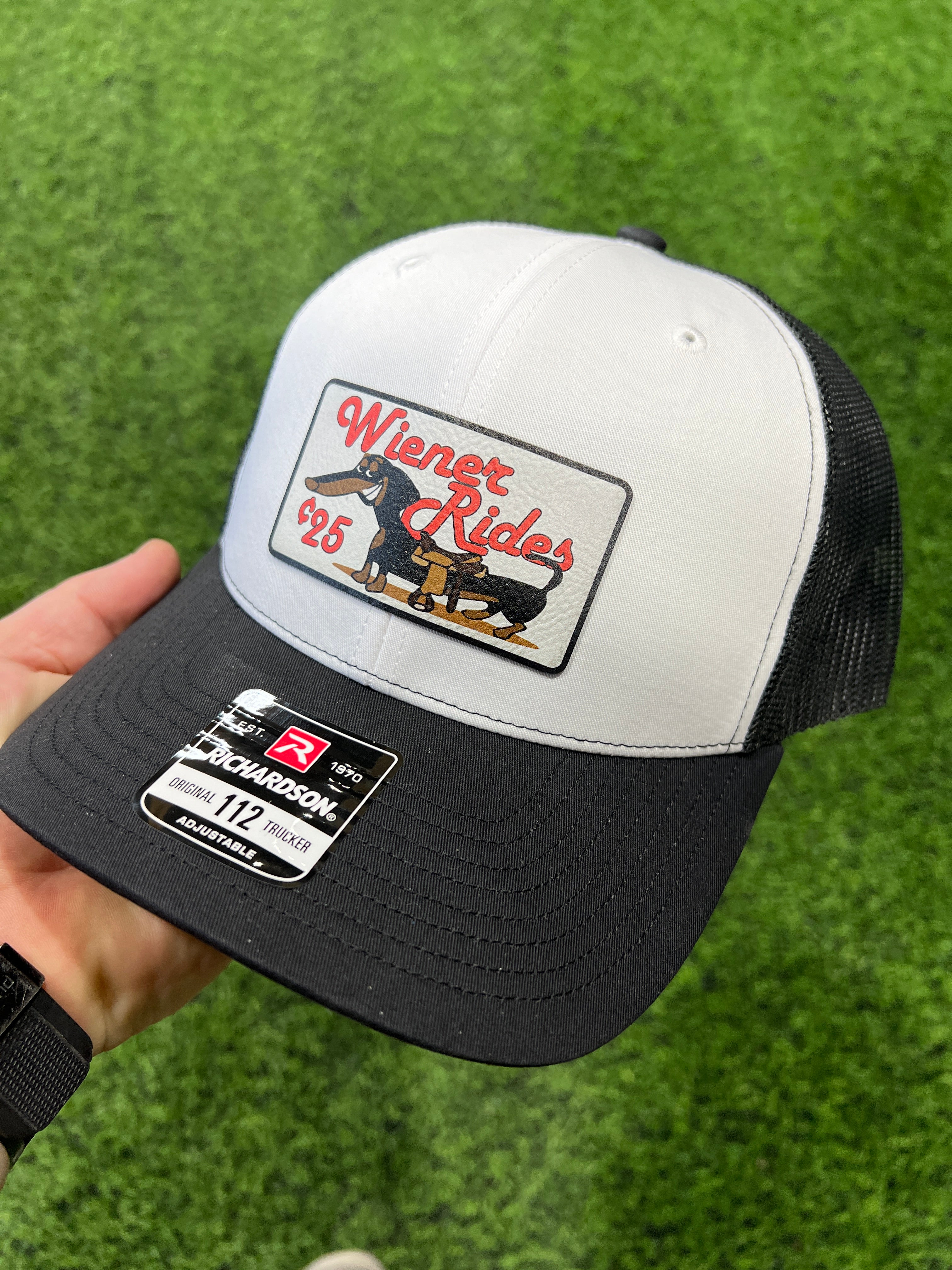 Wiener Rides Patch Hat with a UV Printed Premium Leatherette Patch on a Richardson 112 Trucker Hat