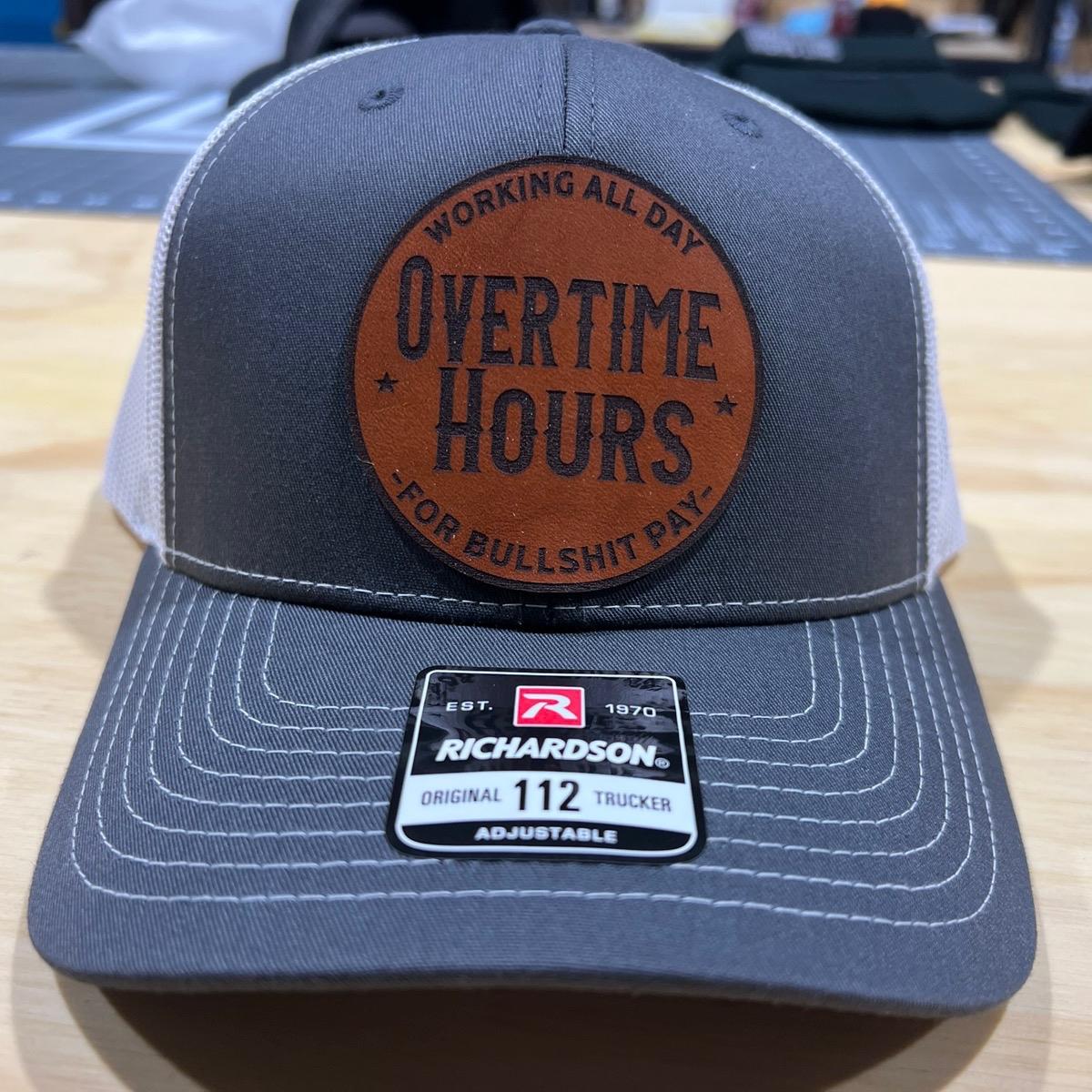 Overtime Hours Hat with Premium Patch on a Richardson 112 Trucker Hat